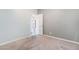Bedroom with neutral paint and carpeting and a doorway leading to the next room at 9883 Russian Hill St, Las Vegas, NV 89141