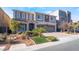 Beautiful two-story home with a well-manicured lawn and a three-car garage at 9883 Russian Hill St, Las Vegas, NV 89141
