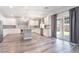 Spacious kitchen featuring white cabinets, stainless steel appliances, and a center island at 9883 Russian Hill St, Las Vegas, NV 89141