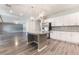Spacious kitchen with granite countertops, stainless steel appliances, a large island, and white cabinets at 9883 Russian Hill St, Las Vegas, NV 89141