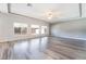Large living room with hardwood floors, recessed lighting, and many windows at 9883 Russian Hill St, Las Vegas, NV 89141