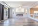 Open living area featuring hardwood floors, fireplace, recessed lighting, and high ceilings at 9883 Russian Hill St, Las Vegas, NV 89141
