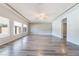 Spacious living room featuring hardwood floors, neutral walls, and recessed lighting at 9883 Russian Hill St, Las Vegas, NV 89141