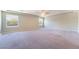 Spacious living room featuring neutral walls, carpet, recessed lighting and large windows at 9883 Russian Hill St, Las Vegas, NV 89141