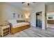 Comfortable bedroom with wood-look flooring and closet with organizational shelves at 1000 Via Canale Dr, Henderson, NV 89011