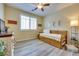 Cozy bedroom with natural light, wood-look floors, and a comfortable trundle bed at 1000 Via Canale Dr, Henderson, NV 89011