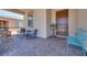 Inviting covered front porch with decorative seating and a well-maintained paver surface at 1000 Via Canale Dr, Henderson, NV 89011