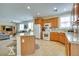 Bright, open kitchen features wooden cabinets, granite countertops, and stainless-steel appliances at 1000 Via Canale Dr, Henderson, NV 89011