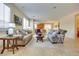 Bright and airy living room featuring comfortable seating and tile floors at 1000 Via Canale Dr, Henderson, NV 89011