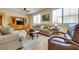 Cozy living room with a large sofa and a decorative entertainment center at 1000 Via Canale Dr, Henderson, NV 89011