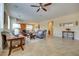 Open-concept living room with neutral tones, tile flooring, and ample natural light at 1000 Via Canale Dr, Henderson, NV 89011