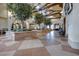 Elegant lobby with tile flooring, high ceilings, wood beams and decorative trees at 1000 Via Canale Dr, Henderson, NV 89011