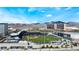 Amazing aerial view of the Las Vegas Ballpark, surrounding buildings, and distant mountain range at 10037 Summer Oak Ln # 102, Las Vegas, NV 89134