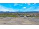 Panoramic aerial view of a suburban community, highlighting expansive vacant land, and a mountain backdrop at 10037 Summer Oak Ln # 102, Las Vegas, NV 89134