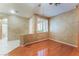 Bonus room with hardwood flooring, shuttered window and view into bathroom area at 10037 Summer Oak Ln # 102, Las Vegas, NV 89134