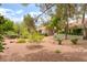 This charming single-story home features mature landscaping, a tile roof, and a manicured yard at 10037 Summer Oak Ln # 102, Las Vegas, NV 89134