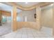 Hallway view featuring tiled flooring, architectural detailing, and seamless transition to different living spaces at 10037 Summer Oak Ln # 102, Las Vegas, NV 89134