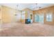 Bright living room featuring a modern fireplace, large windows and sliding glass doors at 10037 Summer Oak Ln # 102, Las Vegas, NV 89134