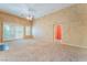 Expansive living room offering ample space and natural light from large sliding glass doors at 10037 Summer Oak Ln # 102, Las Vegas, NV 89134