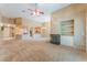 Open concept living room featuring a fireplace and seamless access to the kitchen area at 10037 Summer Oak Ln # 102, Las Vegas, NV 89134