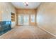 Bright and airy living room complete with sliding glass doors, modern fireplace and custom built-ins at 10037 Summer Oak Ln # 102, Las Vegas, NV 89134