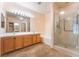 Spacious main bathroom offers double sinks, a soaking tub, and a separate glass enclosed shower at 10037 Summer Oak Ln # 102, Las Vegas, NV 89134