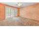Spacious main bedroom with neutral carpet, sliding glass door, and offers serene ambiance at 10037 Summer Oak Ln # 102, Las Vegas, NV 89134