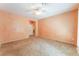 Large main bedroom features neutral colors, a ceiling fan and leads to main bathroom and closet at 10037 Summer Oak Ln # 102, Las Vegas, NV 89134