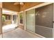 This covered patio features sliding glass doors, an outdoor ceiling fan, and access to the home's interior at 10037 Summer Oak Ln # 102, Las Vegas, NV 89134