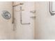 Close up view of shower controls and safety bars inside the glass shower room at 10037 Summer Oak Ln # 102, Las Vegas, NV 89134