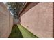 Narrow side yard with artificial grass perfect for dogs at 10454 Gunpowder Falls St, Las Vegas, NV 89183