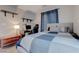 Inviting bedroom with a comfy bed, desk area, and ample natural light from the window at 10454 Gunpowder Falls St, Las Vegas, NV 89183