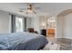 Primary bedroom boasts natural light, wood-style floors, and an ensuite bath with a double sink at 10454 Gunpowder Falls St, Las Vegas, NV 89183