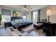Comfortable bedroom features a large bed, decorative rug, and bedside tables with lamps at 10454 Gunpowder Falls St, Las Vegas, NV 89183