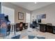 Bedroom with light walls, ample natural light, and a built in dark bookcase and cabinet at 10454 Gunpowder Falls St, Las Vegas, NV 89183