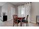 Cozy dining area with a wooden table and chairs beneath natural lighting at 10454 Gunpowder Falls St, Las Vegas, NV 89183