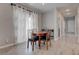 Dining area includes a wooden table and seating with natural light at 10454 Gunpowder Falls St, Las Vegas, NV 89183