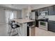 Kitchen area showcasing stainless steel appliances and breakfast bar with seating at 10454 Gunpowder Falls St, Las Vegas, NV 89183