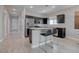 Kitchen with a breakfast bar, stainless steel appliances, and light countertops at 10454 Gunpowder Falls St, Las Vegas, NV 89183