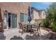 Backyard patio with a dining table and chairs, and sliding glass door to home at 10454 Gunpowder Falls St, Las Vegas, NV 89183