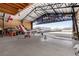 Airplane Hangar with tools, airplane inside, open door with bright, open, airy space and tools at 1100 Mitchell Pl, Pahrump, NV 89060