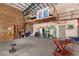View of the hangar with a variety of stored items, workspace, and unique mezzanine level at 1100 Mitchell Pl, Pahrump, NV 89060