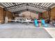 Hangar interior showcasing a private airplane, complete with seating area and open layout at 1100 Mitchell Pl, Pahrump, NV 89060