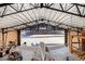 Aerial interior of the hangar featuring a private airplane, adjacent workspace, and an open layout to the exterior at 1100 Mitchell Pl, Pahrump, NV 89060