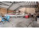 Interior of hangar with private airplane, work area, and second story at 1100 Mitchell Pl, Pahrump, NV 89060