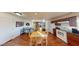 Open kitchen and dining area with matching wooden table and chairs and complete kitchen appliances at 1100 Mitchell Pl, Pahrump, NV 89060