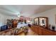 Comfortable bedroom with wooden furniture, a ceiling fan and organized decor at 1100 Mitchell Pl, Pahrump, NV 89060
