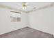 Bedroom features neutral carpet, ceiling fan and a bright window at 114 Tamarack Dr, Henderson, NV 89002