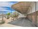 Spacious covered car port with a concrete floor and a clear view of the desert landscaping at 114 Tamarack Dr, Henderson, NV 89002