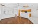 Cozy living room with hardwood floors and an open layout leading to the kitchen at 114 Tamarack Dr, Henderson, NV 89002
